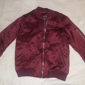 Burgundy jacket.
